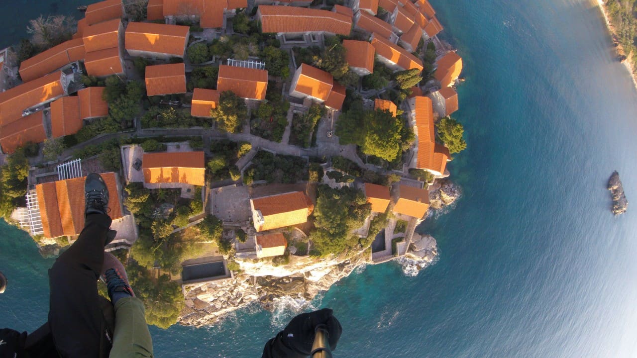 Soar Above Sveti Stefan: A Tandem Paragliding Experience G0050164