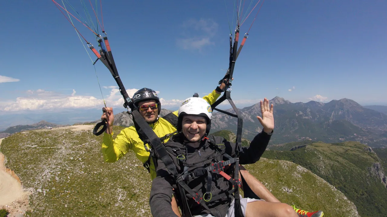High Bar paragliding flight with mountains and sea visible below
