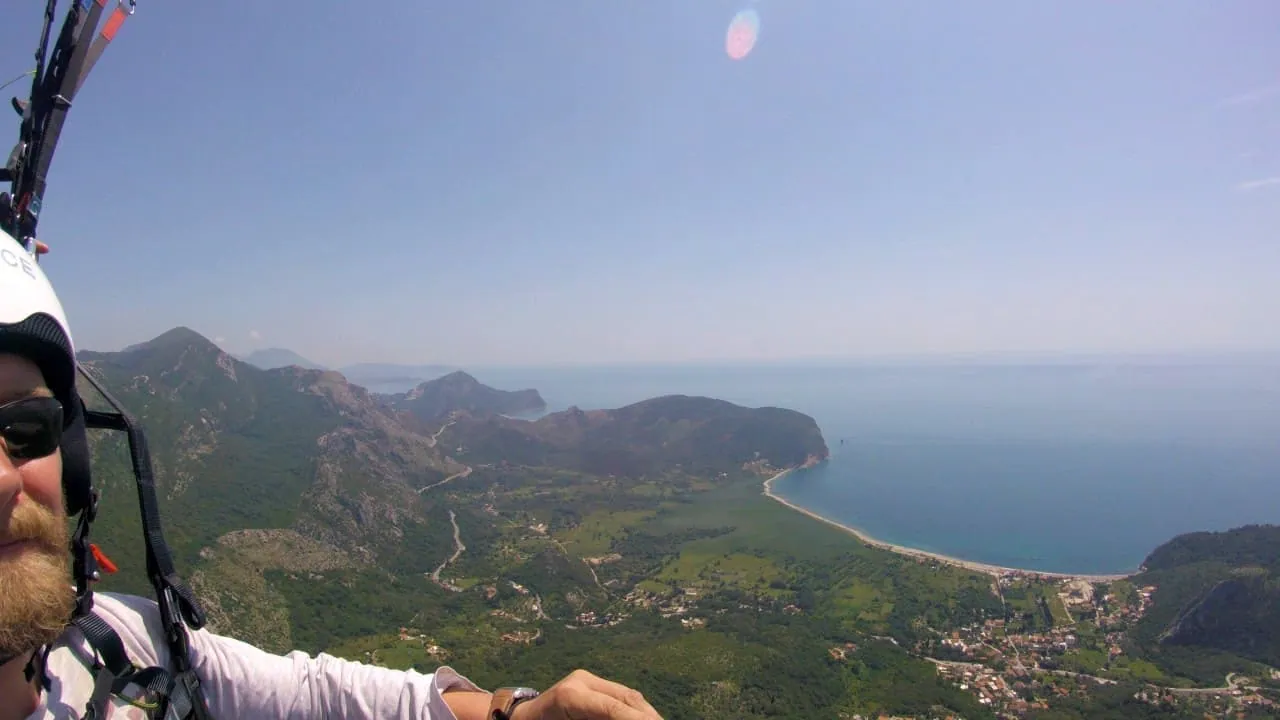 Wide Petrovac and Buljarica coastal view during a tandem paragliding flight